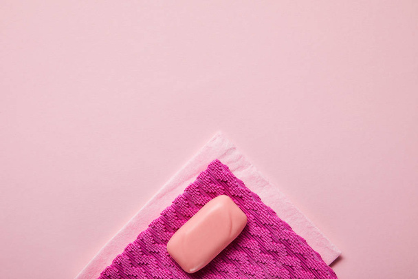 top view of pink rags and soap on pink background  - Φωτογραφία, εικόνα