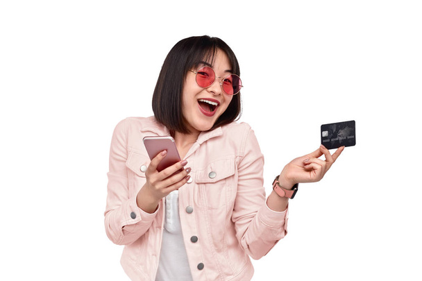 Cheerful ethnic lady using online banking service - 写真・画像
