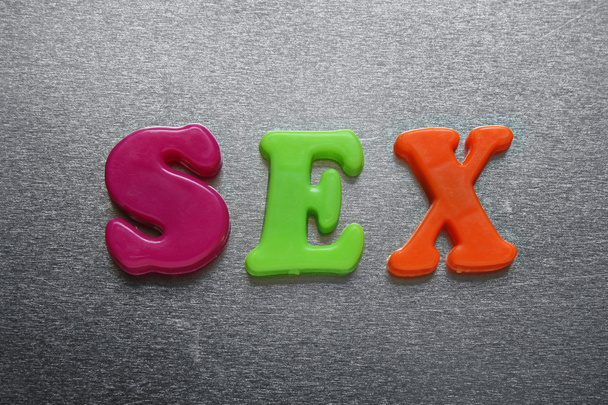 Sex spelled out using colored magnets - Photo, Image