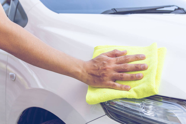 man cleaning car with microfiber cloth - Фото, изображение