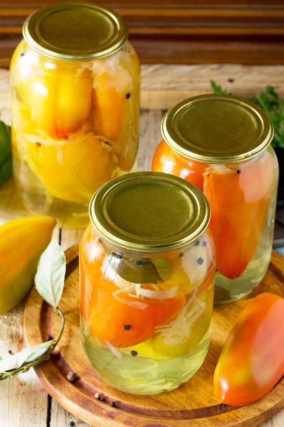 Homemade preserving. Bulgarian Pepper stuffed with vegetables in - Photo, Image