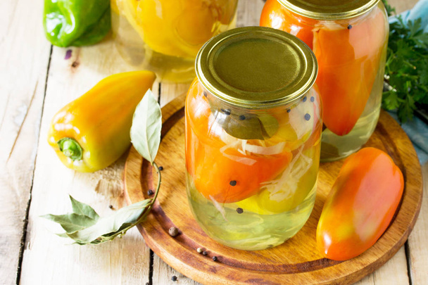 Homemade preserving. Bulgarian Pepper stuffed with vegetables in - Photo, Image