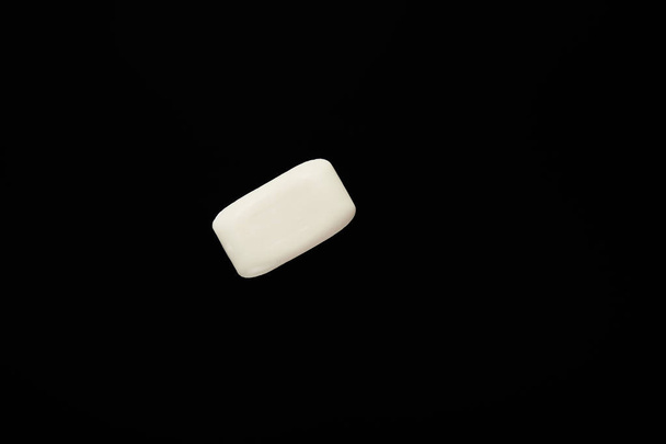 top view of white soap isolated on black with copy space  - Foto, immagini