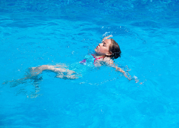 Child swimming backstroke - Photo, Image
