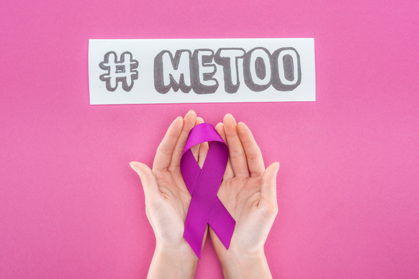 cropped view of woman holding purple awareness ribbon near paper with hashtag me too isolated on pink - Photo, Image