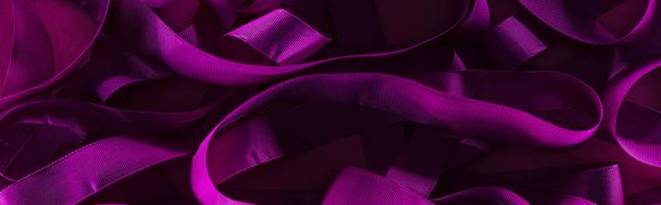 panoramic shot of messy purple stips in shadow on purple background - Fotografie, Obrázek