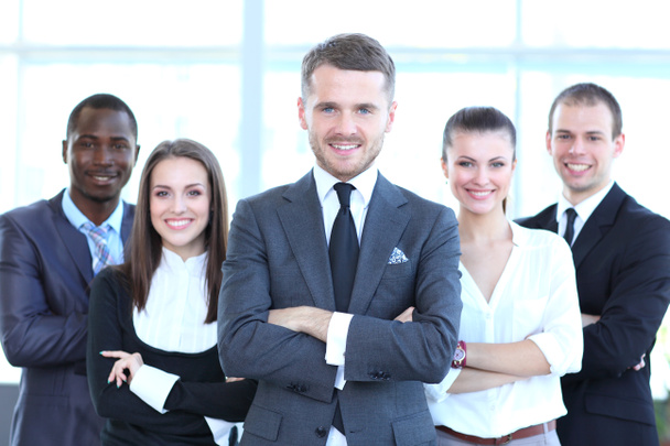 Group portrait of a professional business team looking confidently at camera - 写真・画像