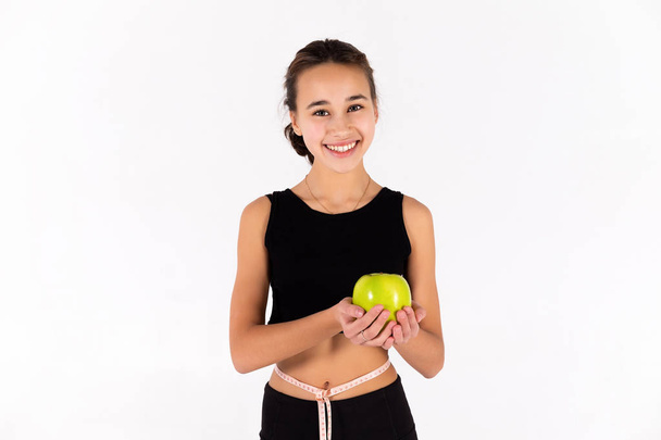 Young athletic girl isolated on white background. - 写真・画像