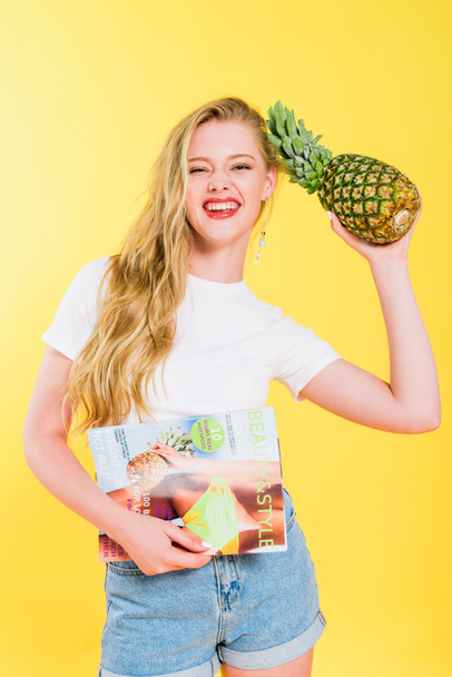 beautiful girl with beauty and style magazine and pineapple On yellow - Valokuva, kuva