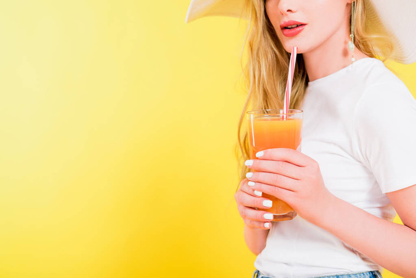 cropped view of blonde girl with cocktail glass On yellow - Photo, Image