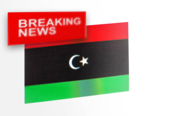 Экстренные новости, флаг Ливии и новости о надписи
 - Фото, изображение