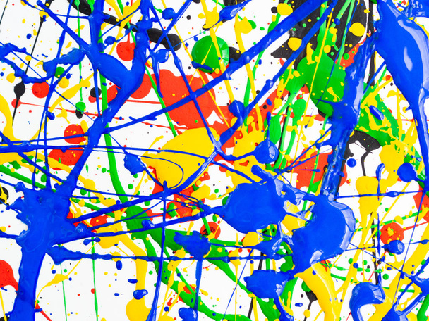 Abstract expressionism art creative background. art of splashes and drips . red black green yellow blue paint on white background. - Photo, Image