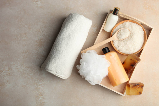 Body care cosmetics, sea salt, natural soap on wooden tray - 写真・画像