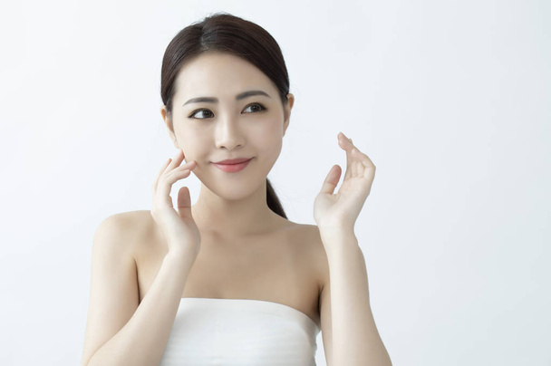 beautiful Asian woman touching her face - Foto, Imagem