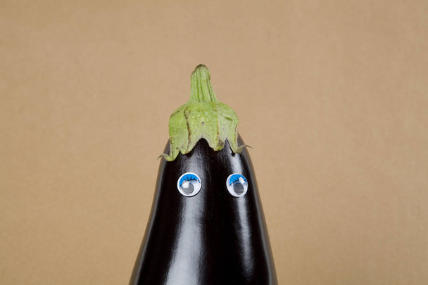 Eggplant doll on a kraft paper - Photo, Image
