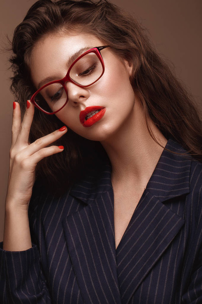 Beautiful girl in stylish clothes with glasses for vision and red sexy lips. - Фото, зображення