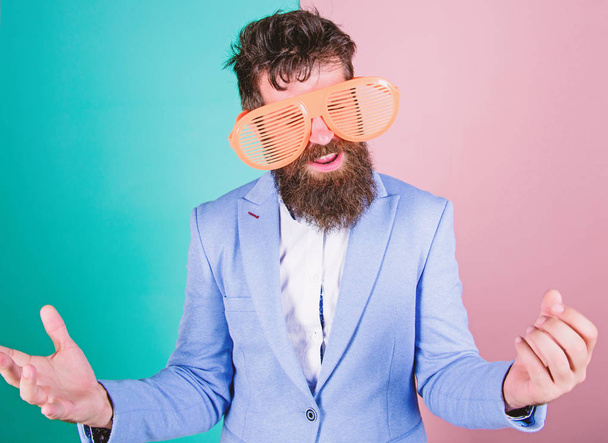 Letting the good times roll. Fashion man with long beard in formal wear. Bearded man wearing party goggles. Funny hipster in extravagant glasses, fashion accessory. Playful businessman enjoying party - Zdjęcie, obraz
