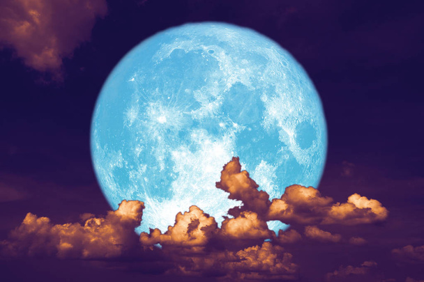 blue strawberry moon back on silhouette heap cloud on night sky - Photo, Image