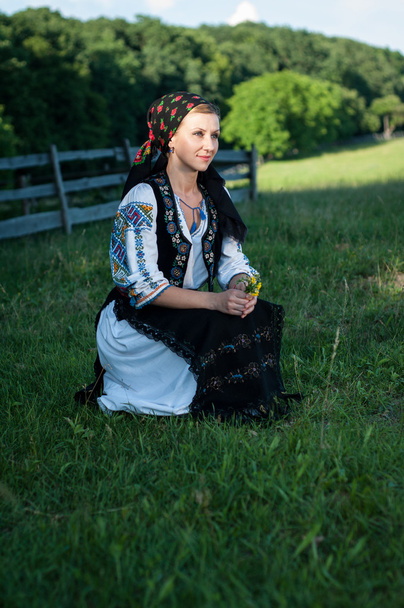 Portrait of young beautiful woman posing in Romanian traditional - Φωτογραφία, εικόνα