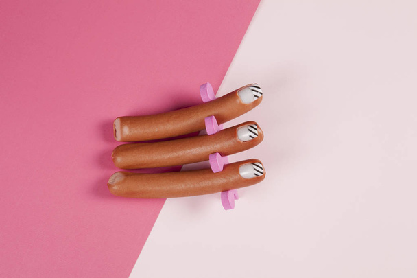gradient pink background and sausage manicure  - Photo, Image