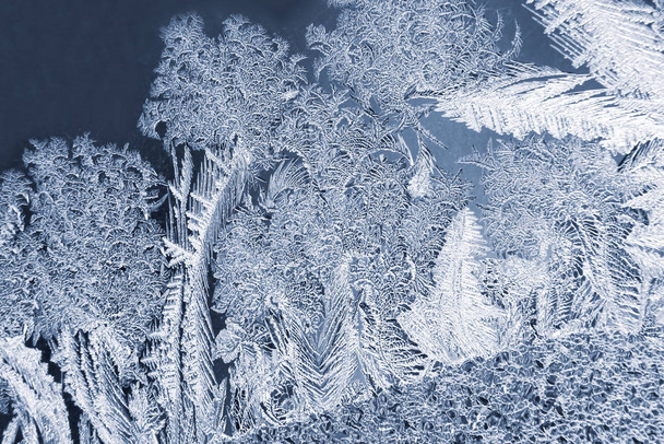 the unique ice patterns on window glass. Seasons of nature and u - Photo, Image