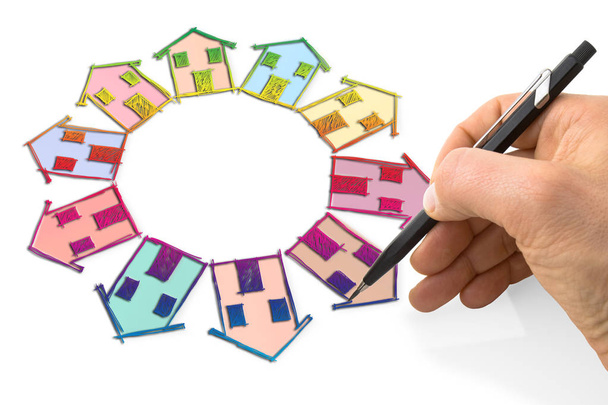 A mão desenha muitas casas no círculo com um lápis em uma folha
 - Foto, Imagem