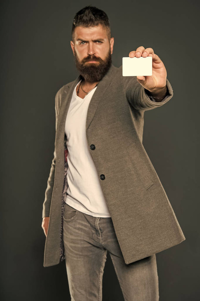 Banking and credit concept. Plastic bank card. Easy money credit. Which bank card easy to get. Easy shopping. Credit card gives you freedom and confidence. Man bearded hipster hold plastic blank card - Φωτογραφία, εικόνα