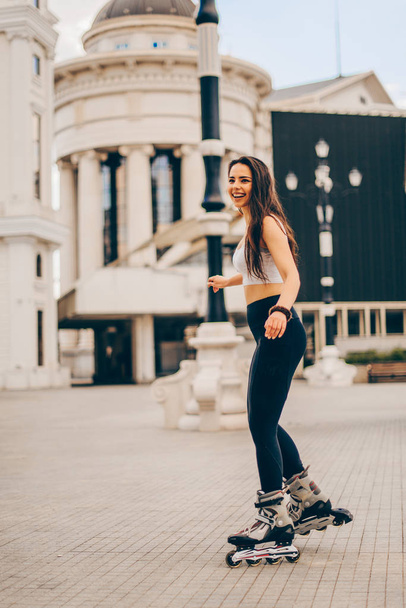 Girl with roller skates outdoors - Fotografie, Obrázek