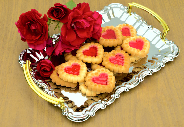 Heart-shaped cookies and roses on a metal tray - Фото, изображение