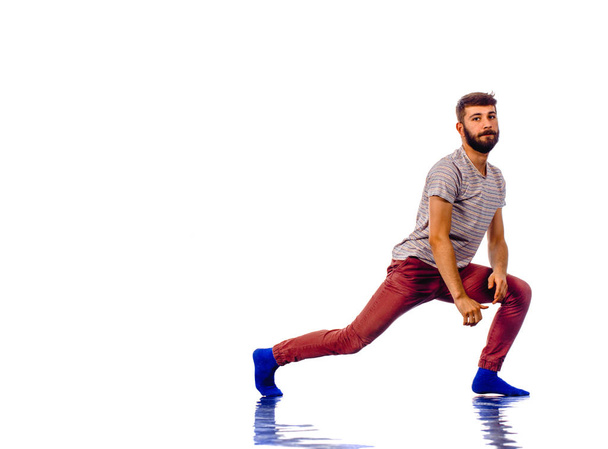 Young man dancing hip-hop at studio - Fotó, kép