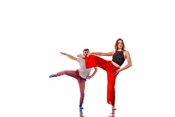 Pair of dancers isolated on the white wall - Photo, Image