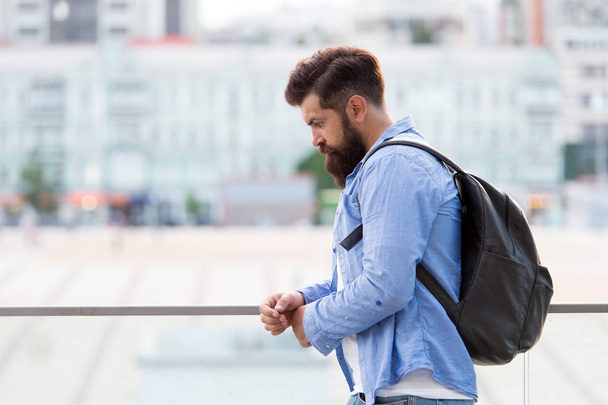 Tourist handsome thoughtful hipster backpack. Man with beard and rucksack explore city. Travelling concept. Tourist on vacation. Hipster modern tourist urban background. Looking for adventures - 写真・画像