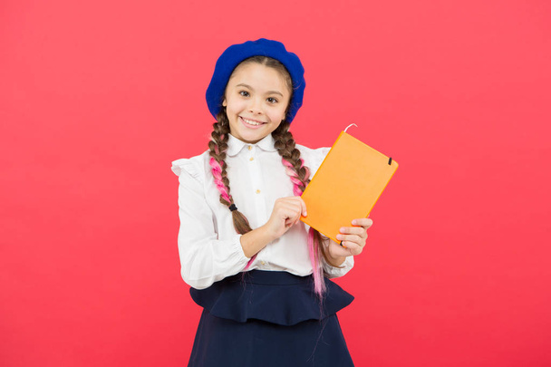Preparing activity book writing. Reading skills. Study language. Interesting story. Adorable little girl with school exercise book. Achieve knowledge. Education concept. Cute small child holding book - Φωτογραφία, εικόνα