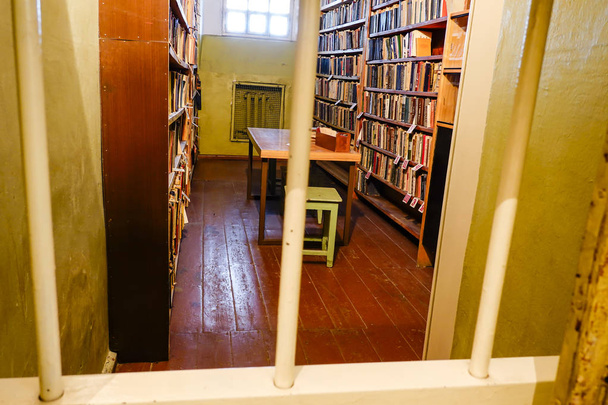 Vilnius, Lithuania The small library inside the Museum of Occupations and Freedom Fights, previously Museum of Genocide Victims, and also known as the KGB museum, where the KGB held and tortured dissidents. - Photo, Image