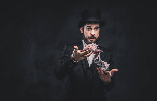 Magician showing trick with playing cards. - Photo, Image