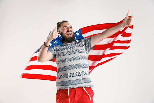 Young man with the flag of United States of America - Фото, изображение