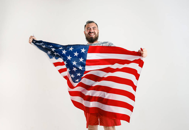 Young man with the flag of United States of America - Фото, зображення