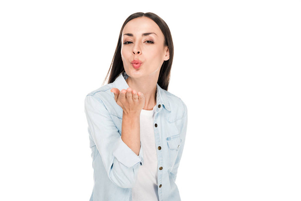 attractive young woman blowing kiss isolated on white - Valokuva, kuva