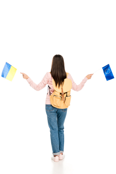 vista completa del estudiante con mochila sosteniendo banderas ucranianas y europeas aisladas en blanco
 - Foto, Imagen