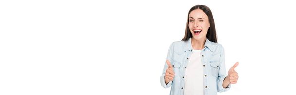 happy winking brunette woman showing thumbs up isolated on white, panoramic shot - Photo, Image
