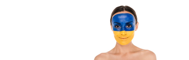 smiling naked young woman with painted Ukrainian flag on skin isolated on white, panoramic shot - Photo, Image
