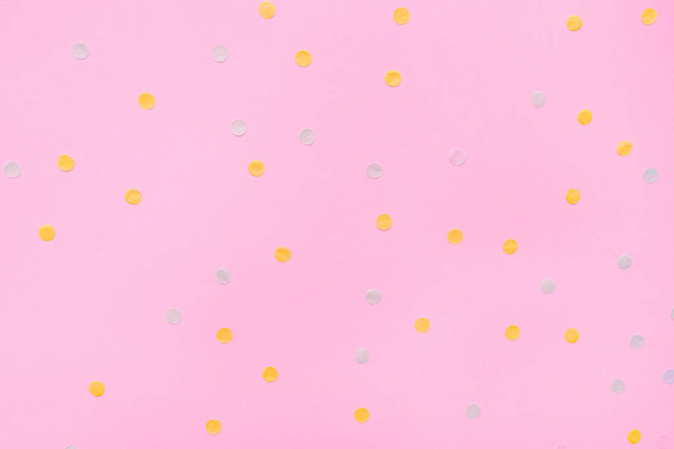 Pink pastel festive background with multicolored confetti. - Foto, afbeelding