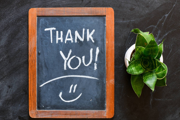 Thank you written on a chalk board, black background  - Photo, Image
