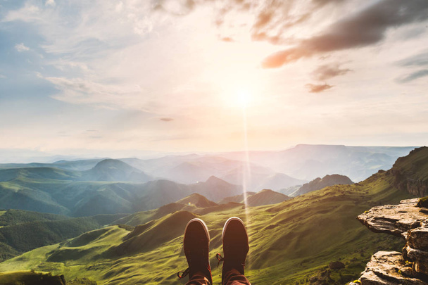 Feet Selfie hipster shoes Traveler relaxing on cliff mountains outdoor with aerial sunset evening view mountains on background Lifestyle hiking Travel concept summer vacations - Valokuva, kuva