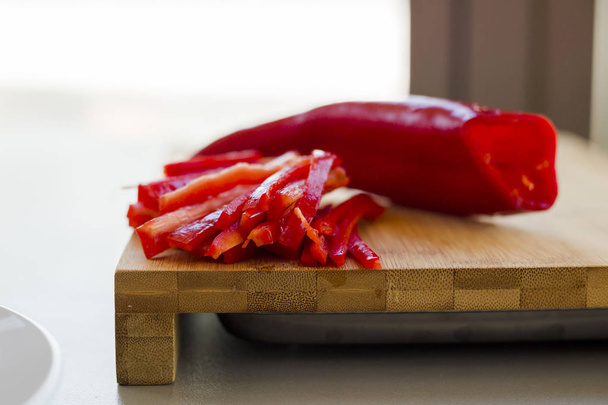  fresh red hot chili peppers on wooden cutting board , close-up  - Foto, Imagem