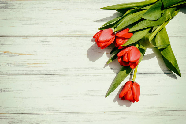 Background of tulips on a wooden - Foto, Imagen