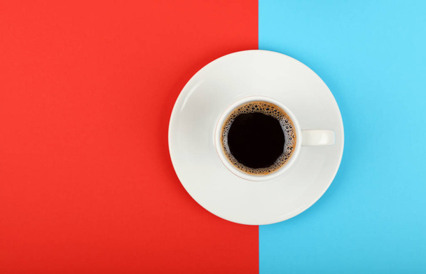 Full white espresso coffee cup on red and blue - Photo, Image