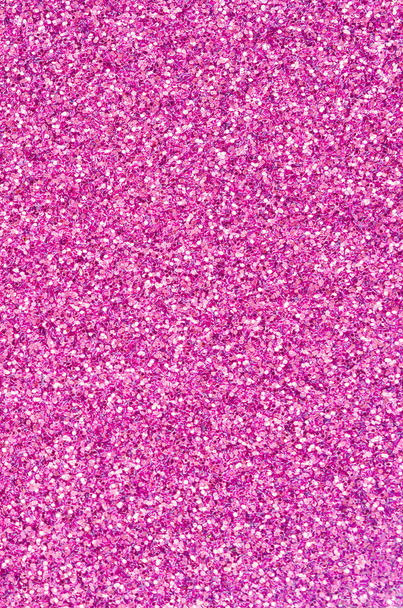 Pink decorative sequins. Background image with shiny bokeh lights from small elements - Photo, Image