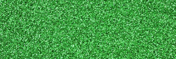 Valtava määrä vihreitä koriste paljetteja. Taustakuva kiiltävä bokeh valot pieniä elementtejä
 - Valokuva, kuva