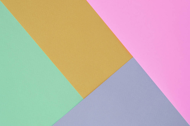 Textuur achtergrond van mode pastel kleuren. Roze, Violet, oranje en blauw geometrische patroon papieren. - Foto, afbeelding